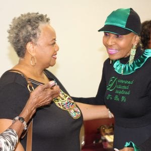 Two older adults greet SAI 2018 special guest speaker, Ernestine Shepherd