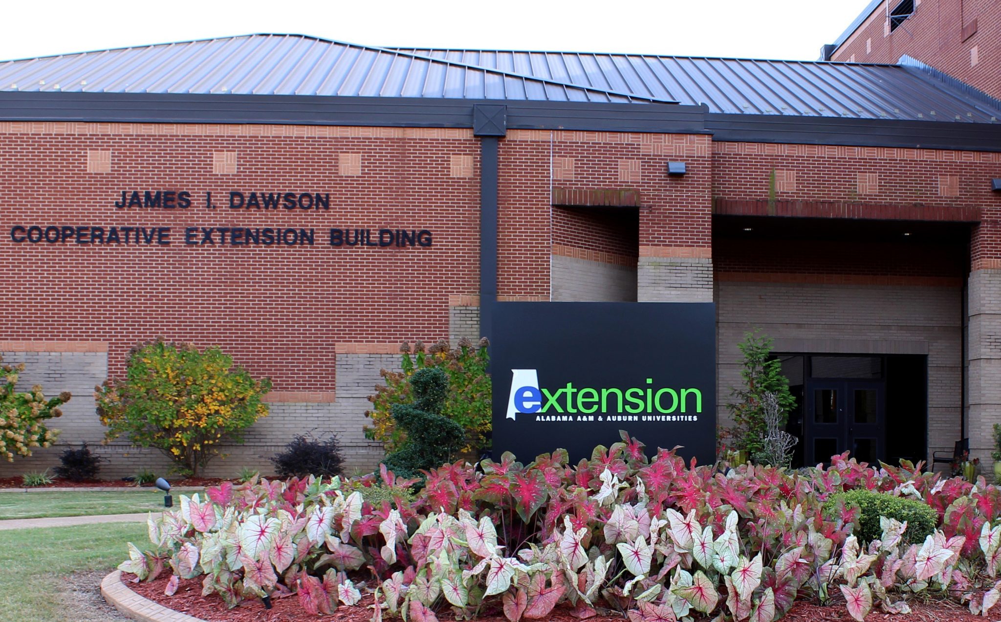 Exterior of the Dawson building with Extension sign in front