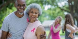 Senior couple attending charity breast cancer race for the cure.