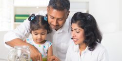 Indian family teaching about saving money
