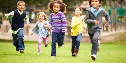 Group of children running in the park.