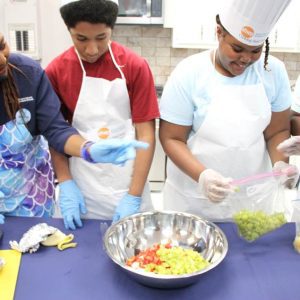 Macon County EFNEP educator Mary Bedell provides a fun interactive food demonstration for her cooking boot camp.