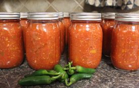 Jars of homemade salsa with peppers