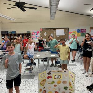 Teen Cuisine participants in Coffee County learn how to prepare quick and easy fruit sticks for on the go snacks that are both delicious and healthy.