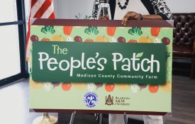 The People's Patch Madison County Community Farm sign.