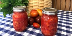Jars of tomatoes preserved by water bath canning.