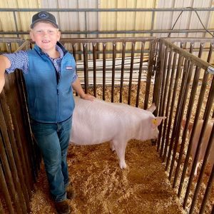 A 4-H member participating in Pig Squeal