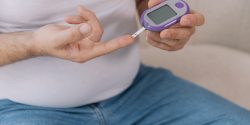 man checking his blood sugar