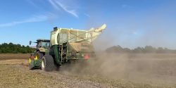 A peanut combine in a field.