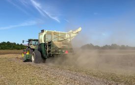 A peanut combine in a field.