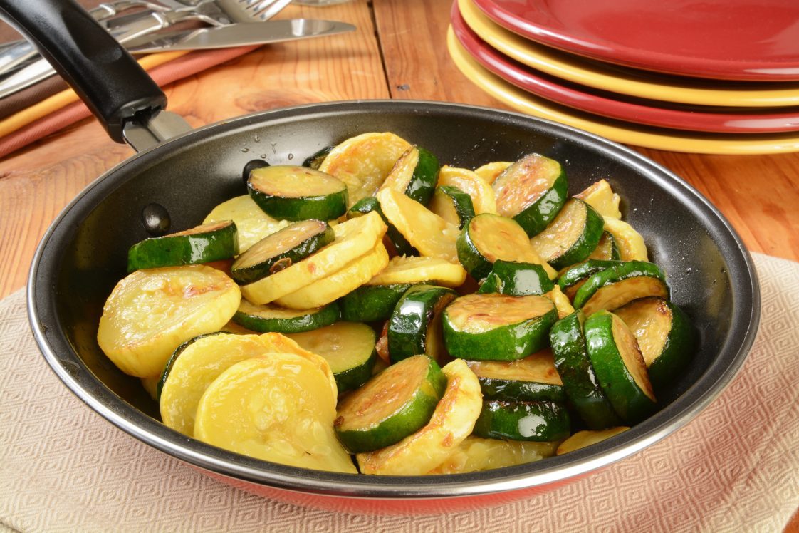 Sautéed summer and zucchini squash in a frying pan